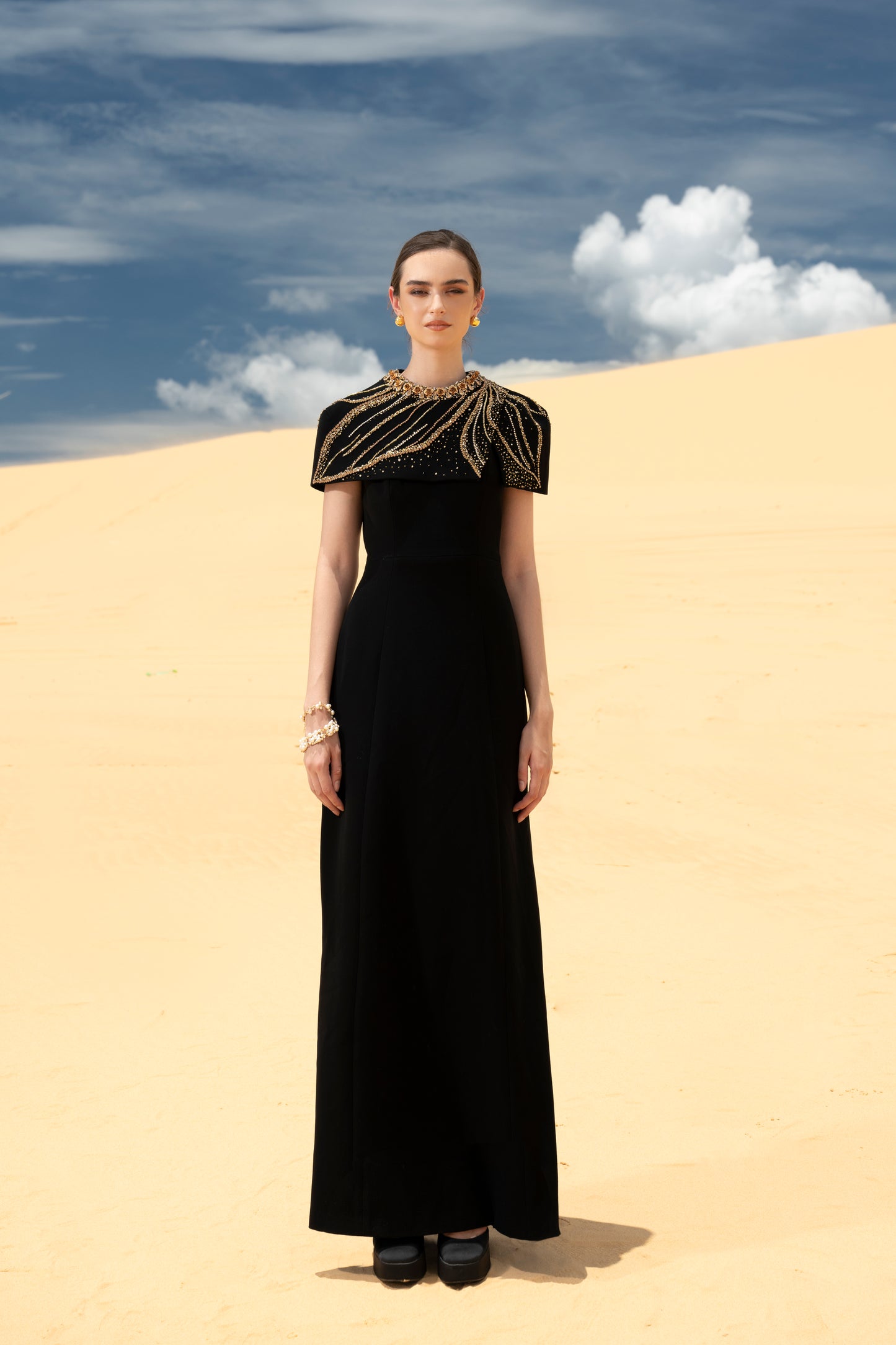 Black Cape-Style Evening Gown with Gold Embellishments