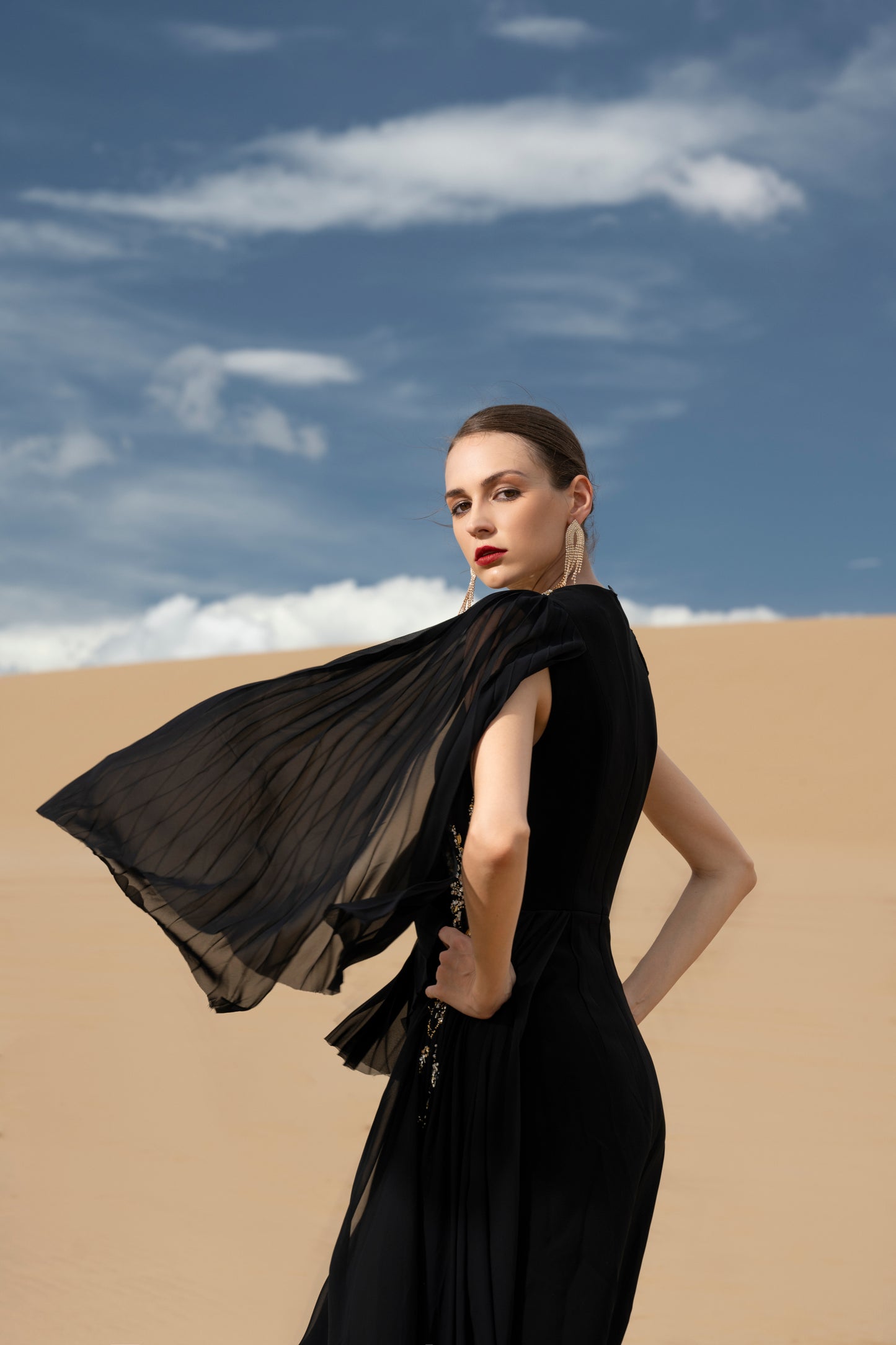 Black Flowing Chiffon Gown with Flared Sleeves and Gold Embellishments