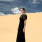 Black Cape-Style Evening Gown with Gold Embellishments